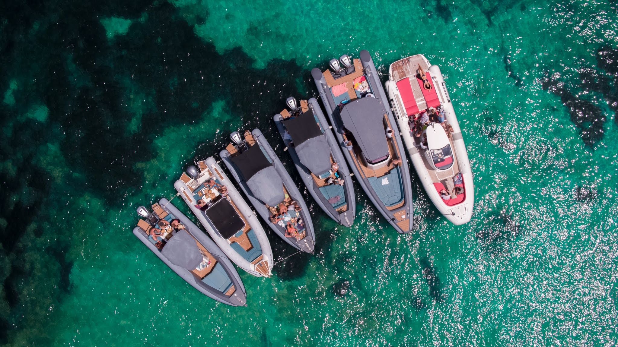 A group of RIB's which belong to a boat club where a membership is required in order to use them. 