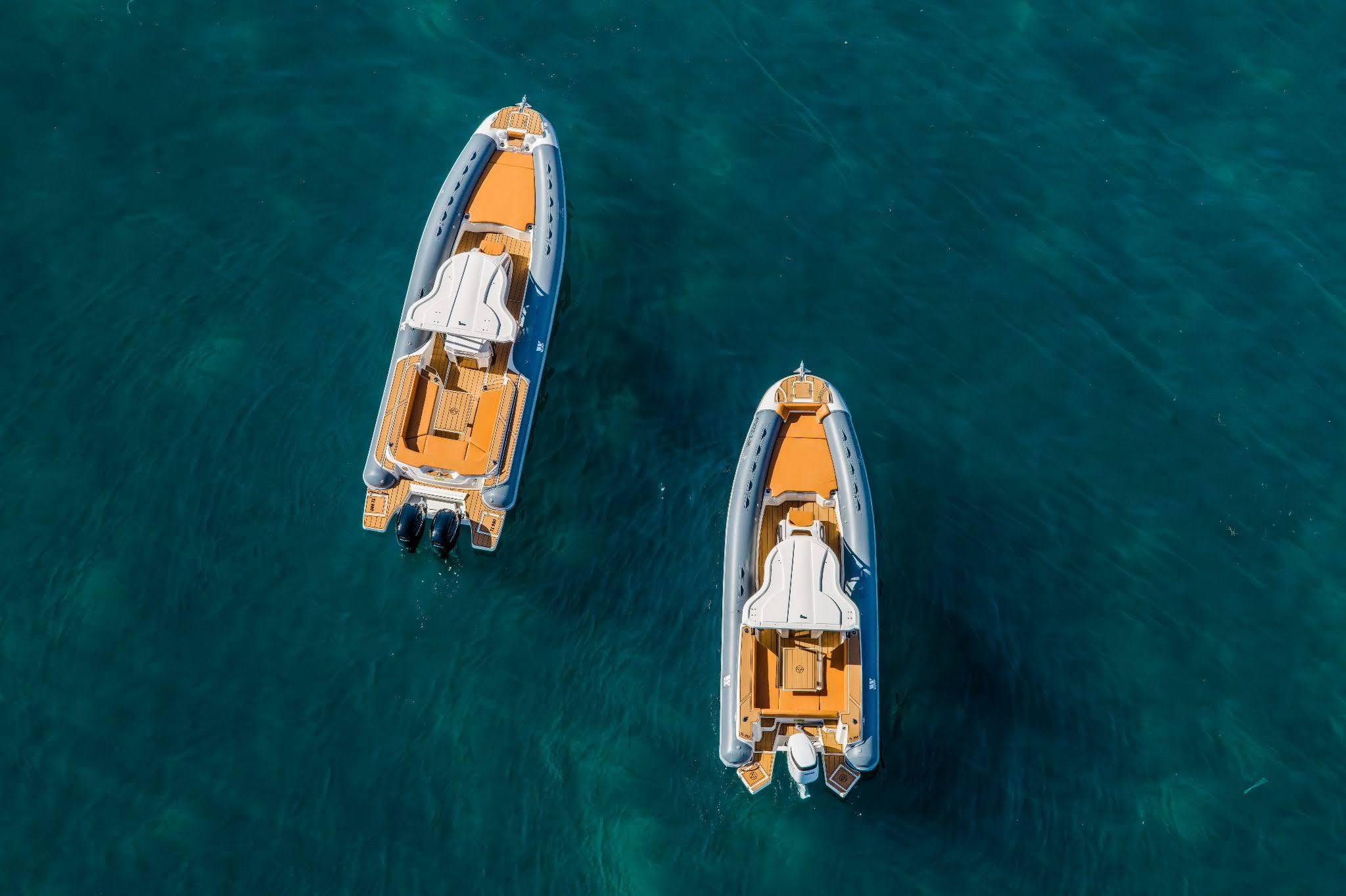 A man driving a RIB boat from a Mallorca boat club he has recently joined, showcasing the experience to Join a Boat club for premium boating access and coastal adventures.