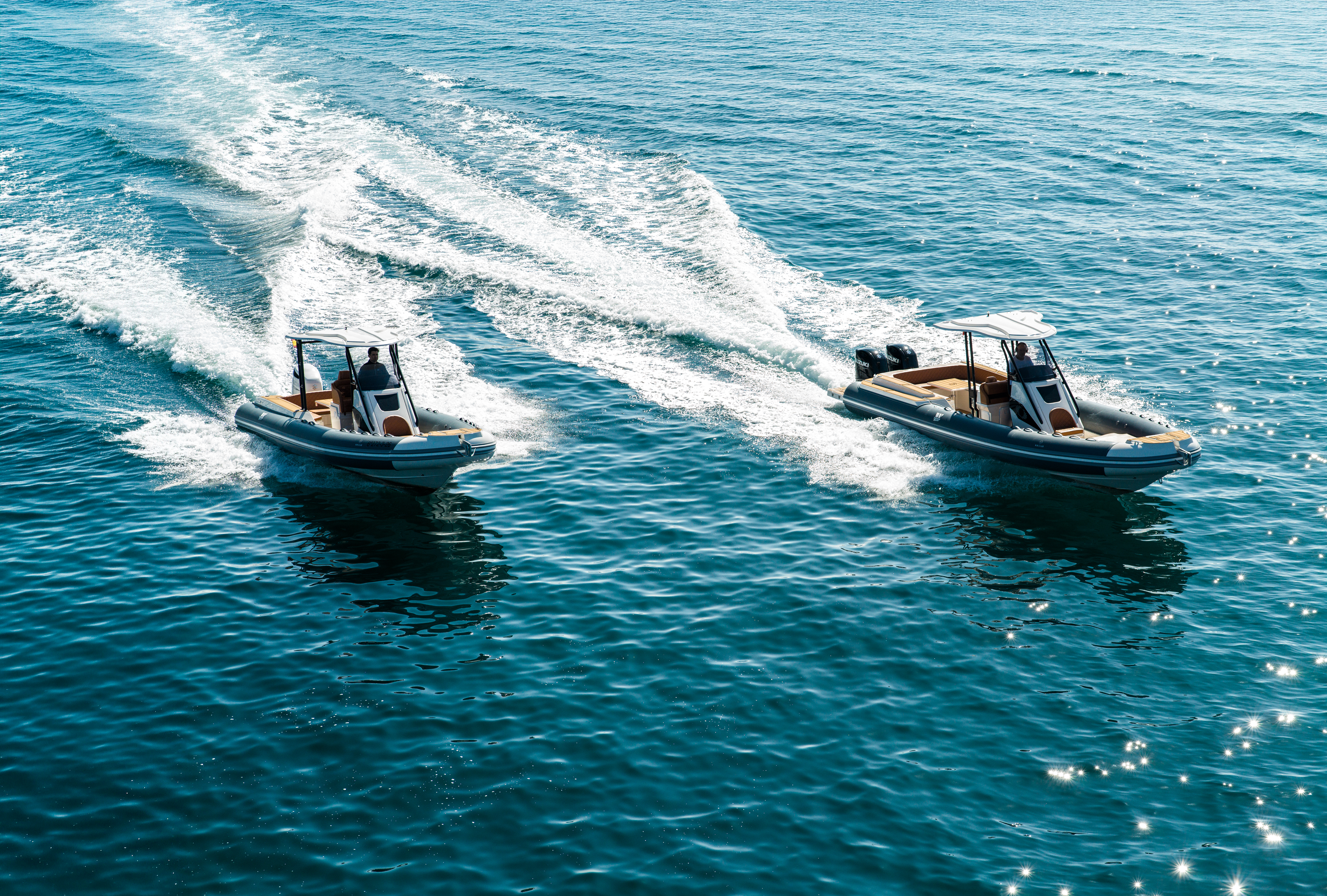 Two RIBs racing on the sea after peak season, to avoid the crowds.