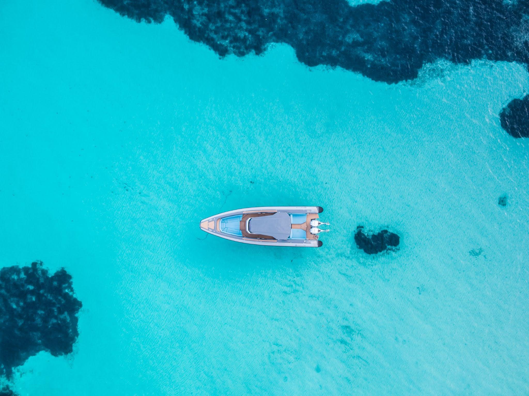 People visiting Mallorca by boat during the summer to enjoy the heat of the sun. 